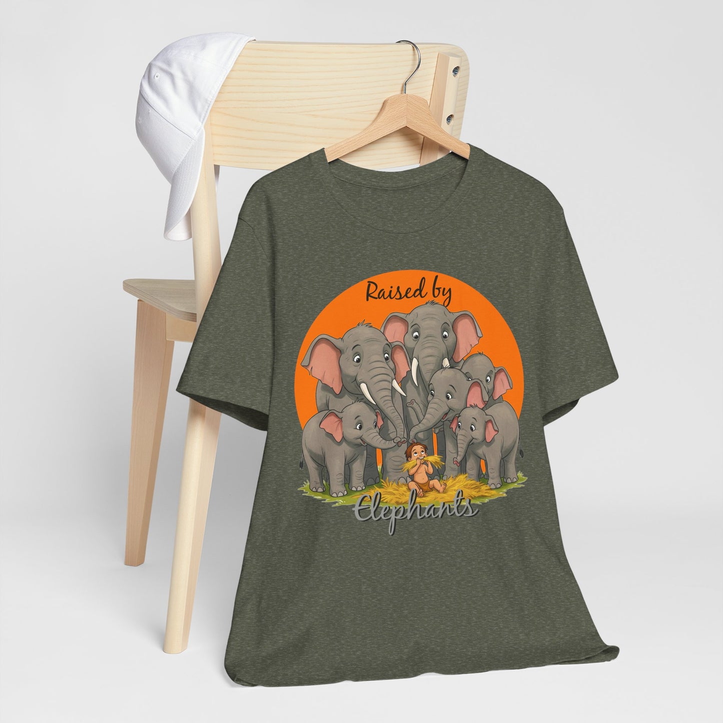 Elephant Lovers Tee - Funny 'Raised by Elephants' Unisex Jersey Short Sleeve Shirt - Wildlife and Nature Lovers Shirt (Male Character Version) - Schmartypants
